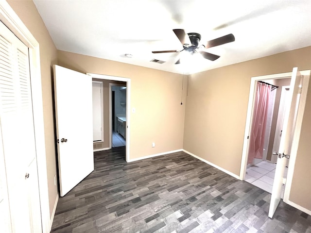 unfurnished bedroom with dark hardwood / wood-style floors, ceiling fan, and a closet