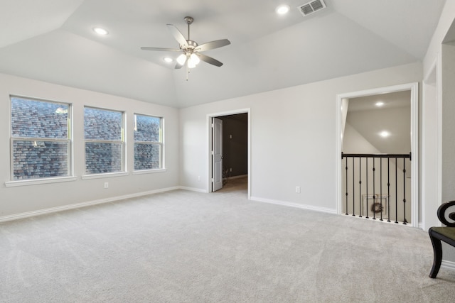 spare room with lofted ceiling, baseboards, visible vents, and recessed lighting