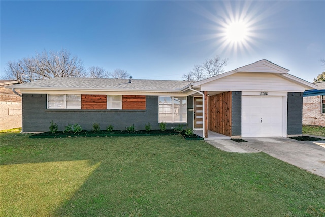 single story home featuring a garage and a front lawn