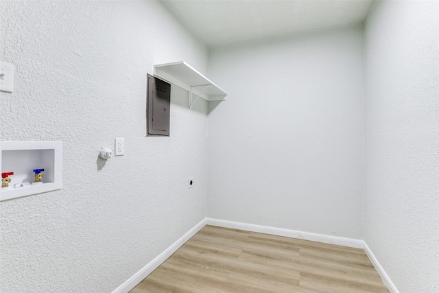 laundry area with wood-type flooring, electric dryer hookup, washer hookup, and electric panel