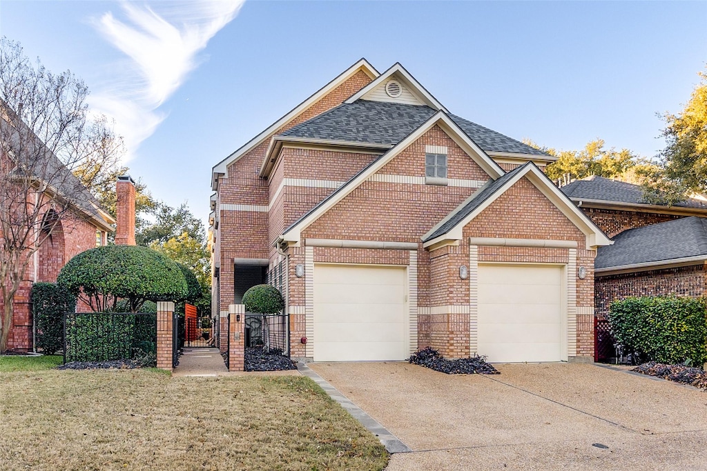 view of front of house with a garage and a front yard