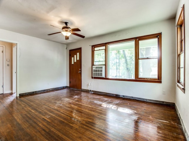 interior space featuring ceiling fan, cooling unit, and dark wood-type flooring