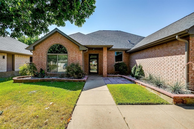 view of front of home with a front yard