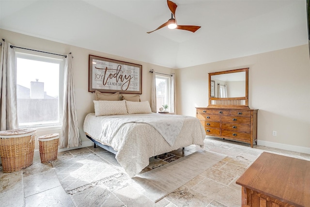 bedroom with ceiling fan and multiple windows