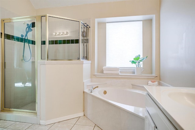 bathroom featuring vanity, tile patterned flooring, and plus walk in shower