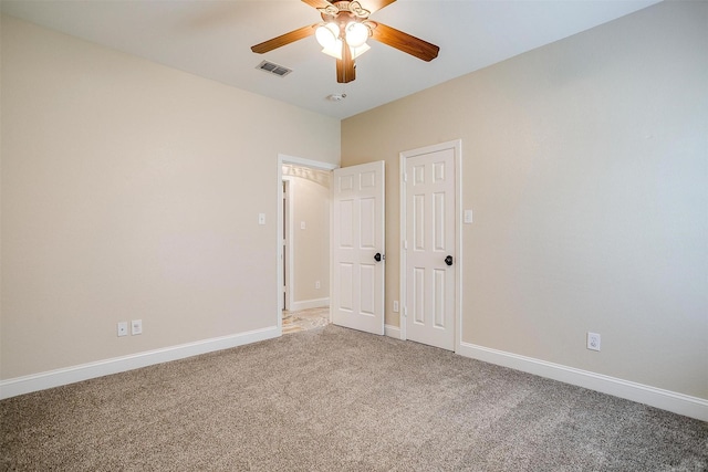 empty room with carpet flooring and ceiling fan