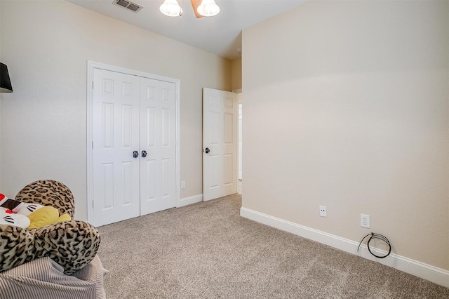 bedroom featuring carpet and a closet