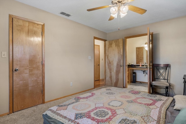 bedroom with visible vents, ceiling fan, baseboards, and a sink