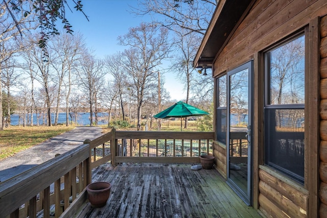 wooden deck featuring a water view