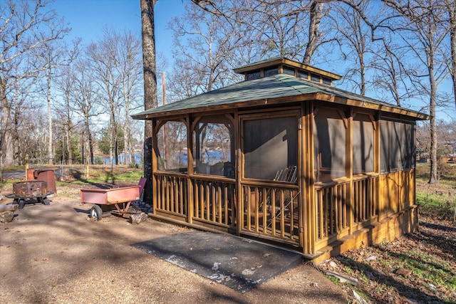 view of outdoor structure featuring a sunroom