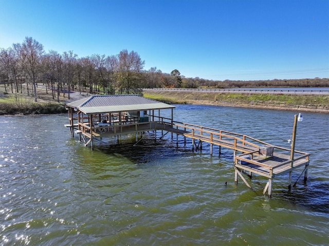 dock area with a water view and boat lift