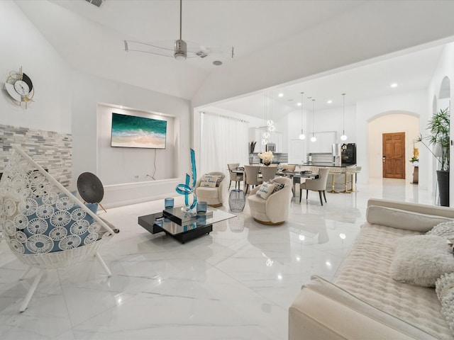 living room with vaulted ceiling and ceiling fan