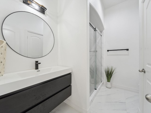 bathroom with vanity and a shower with shower door