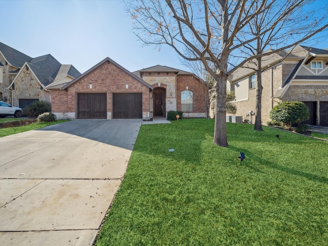 view of front of property featuring a garage and a front lawn