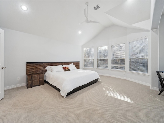 bedroom featuring lofted ceiling and light carpet