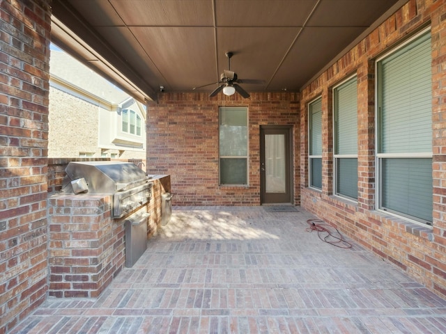 view of patio / terrace with an outdoor kitchen, area for grilling, and ceiling fan