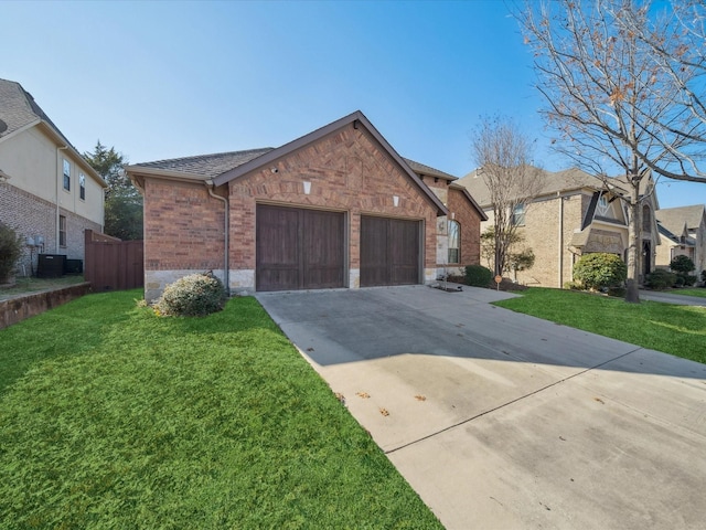 view of front of home with a garage and a front lawn