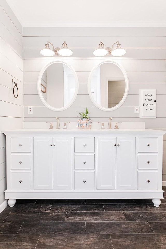 bathroom with wood walls and vanity