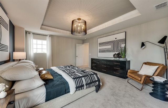 bedroom featuring a raised ceiling, light carpet, and a notable chandelier