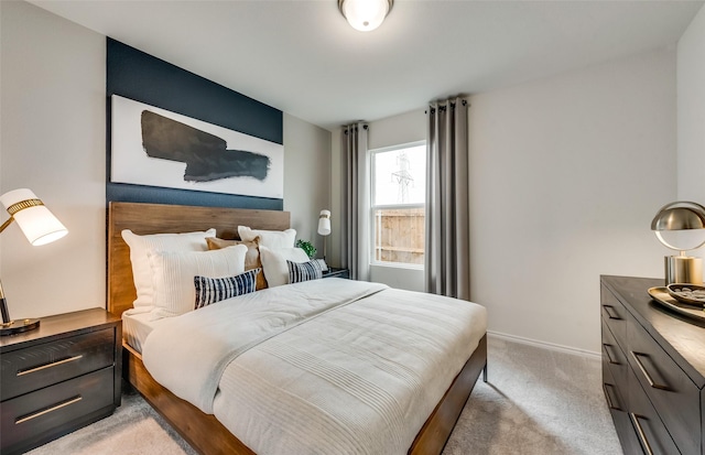 bedroom featuring light colored carpet