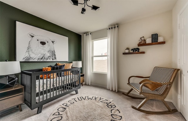 carpeted bedroom with a crib