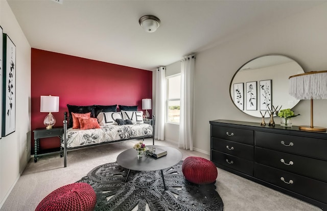 bedroom featuring light colored carpet