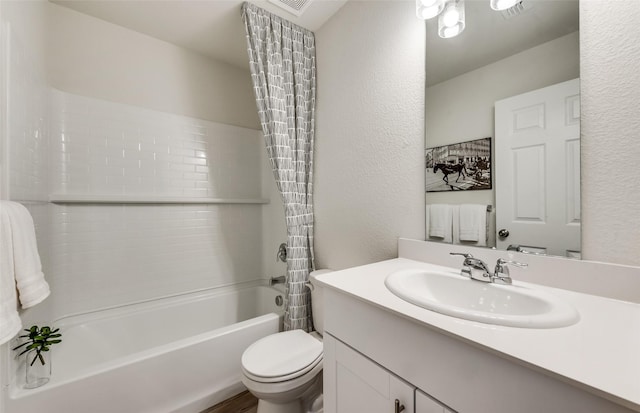 full bathroom featuring vanity, shower / tub combo with curtain, and toilet