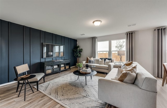 living room with light hardwood / wood-style flooring