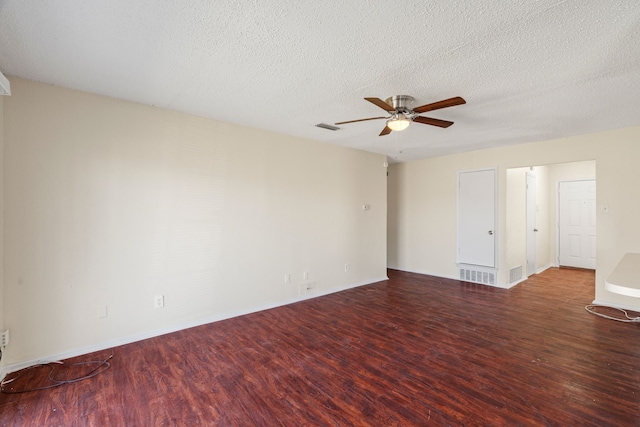 empty room with hardwood / wood-style floors, ceiling fan, and a textured ceiling