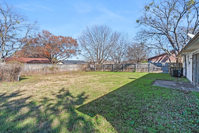 view of yard featuring central air condition unit