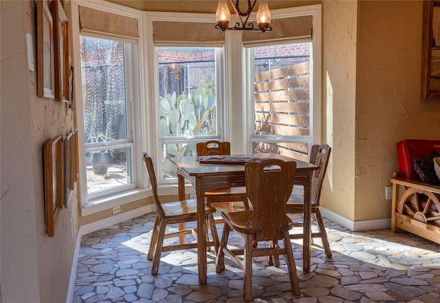 dining space featuring a chandelier