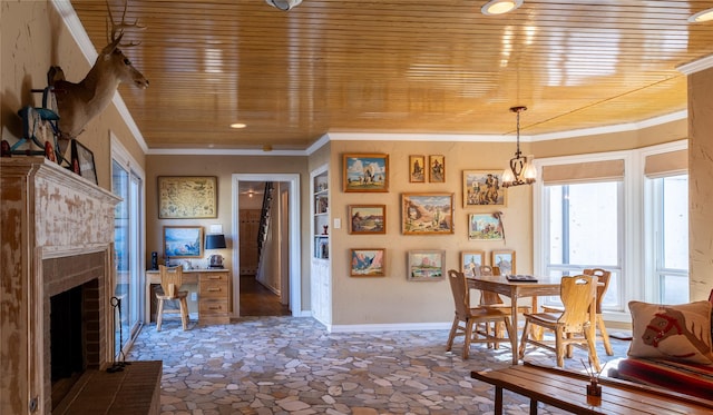 dining space with built in shelves, a chandelier, a fireplace, and wooden ceiling