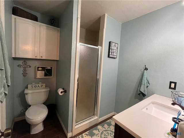 full bath featuring toilet, a stall shower, vanity, wood finished floors, and baseboards