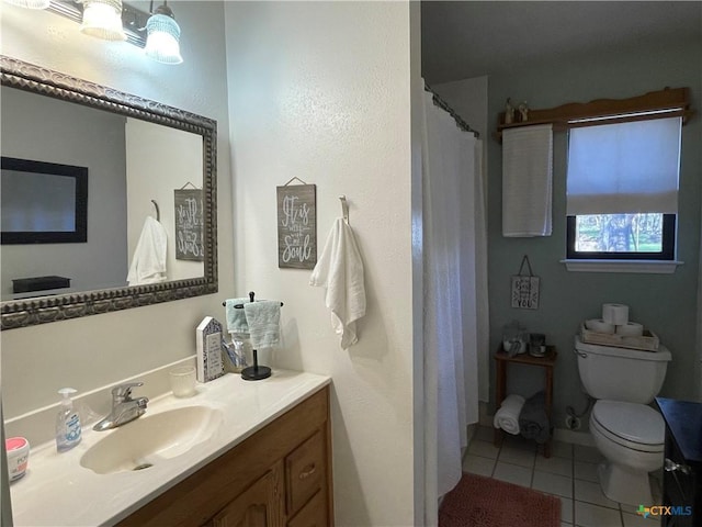 full bath featuring toilet, tile patterned flooring, and vanity