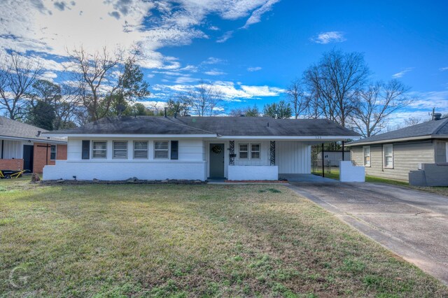 ranch-style house with a front lawn and a carport