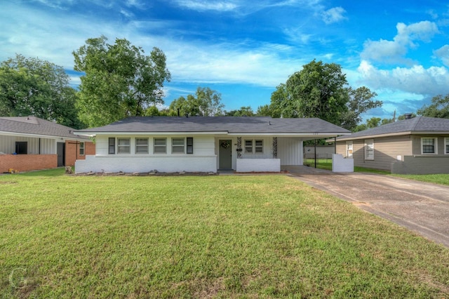 single story home with driveway, brick siding, an attached carport, and a front lawn