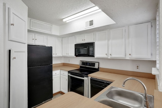 kitchen featuring black appliances, white cabinetry, sink, and a textured ceiling