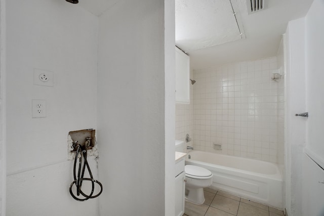 full bathroom with tile patterned flooring, vanity, toilet, and tiled shower / bath combo