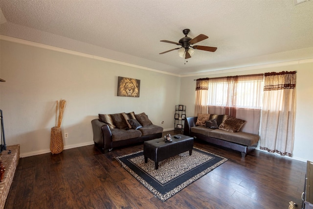 living room with a textured ceiling, dark hardwood / wood-style flooring, and ceiling fan