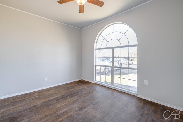 unfurnished room with ceiling fan, crown molding, dark wood-type flooring, and a wealth of natural light