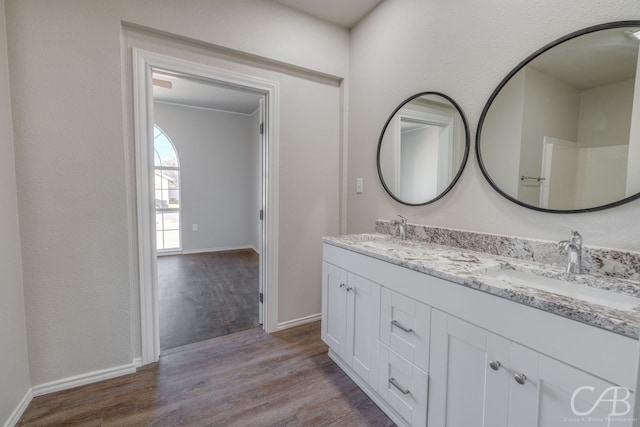 bathroom featuring vanity and hardwood / wood-style flooring