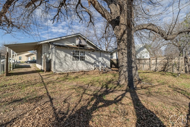 rear view of house with a carport