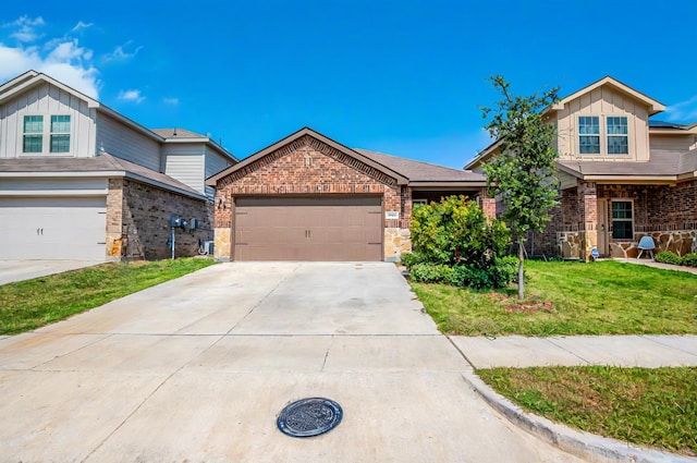 view of front of home with driveway, brick siding, and a front yard