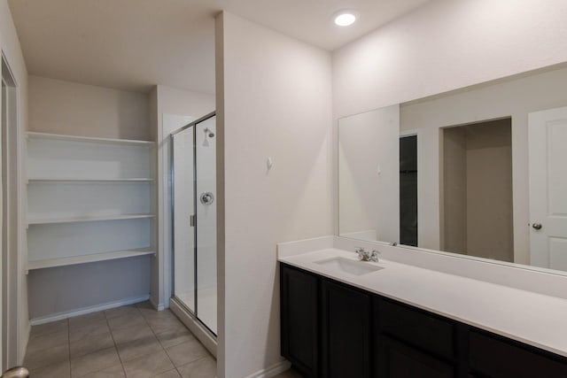 bathroom featuring vanity, tile patterned floors, and an enclosed shower