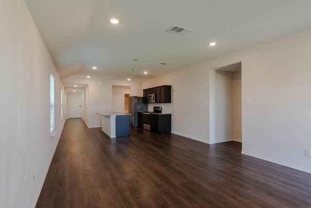 unfurnished living room featuring dark wood-type flooring