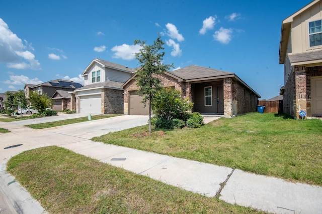 view of front of house with a front yard and a garage