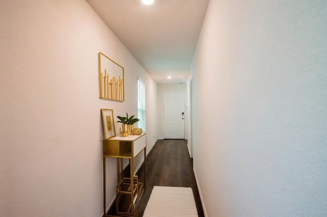 hall featuring recessed lighting, dark wood finished floors, and baseboards