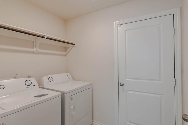 washroom with independent washer and dryer