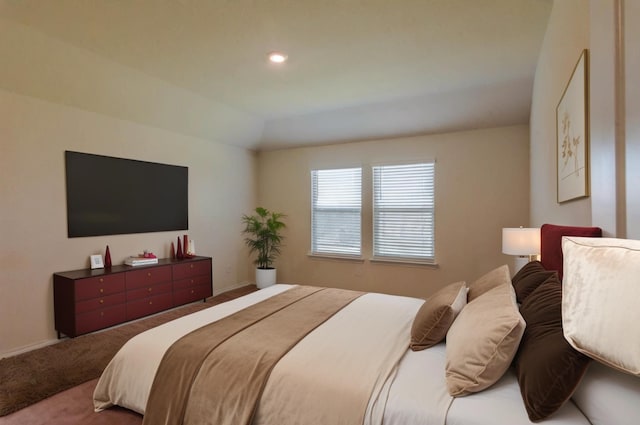 carpeted bedroom with lofted ceiling, baseboards, and recessed lighting