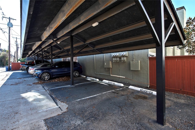 view of vehicle parking featuring a carport